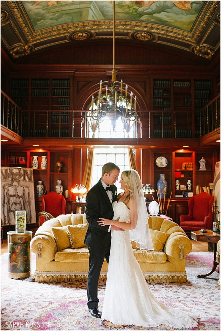 Bride and groom inside mansion