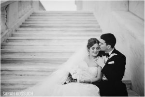 Black and White, bride and groom embrace on stairs at DIA