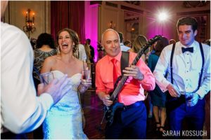 Bride and groom on dance floor with band