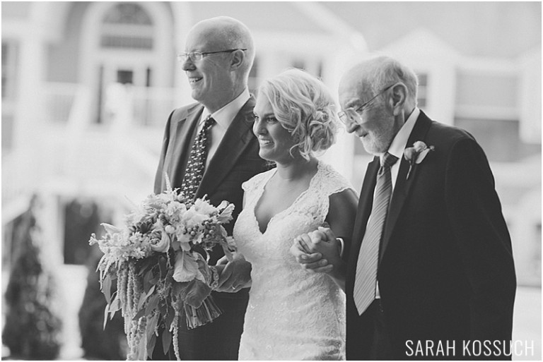 Bride escorted down aisle with father and grandfather