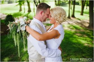 Bride and groom lovingly embrace