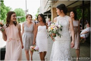 Bride walks with bridesmaids