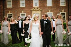 Bride and groom walk with bridal party