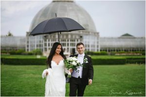 Rainy wedding day, Bride and Groom walking with umbrella, Rainy bliss, Spring Wedding, Detroit Yacht Club, Belle Isle, Detroit Wedding, Sarah Kossuch Photography
