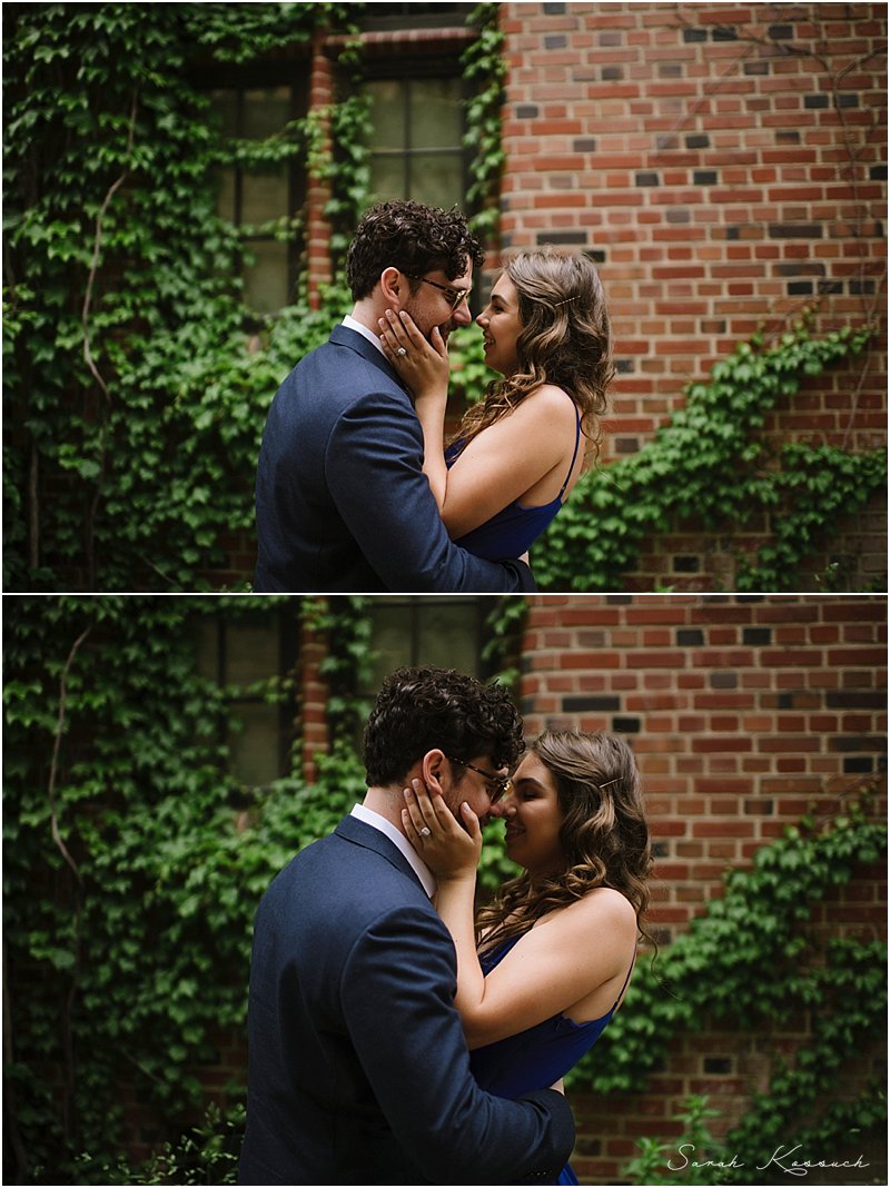 Couple gets in close for portrait with brick and vine backdrop