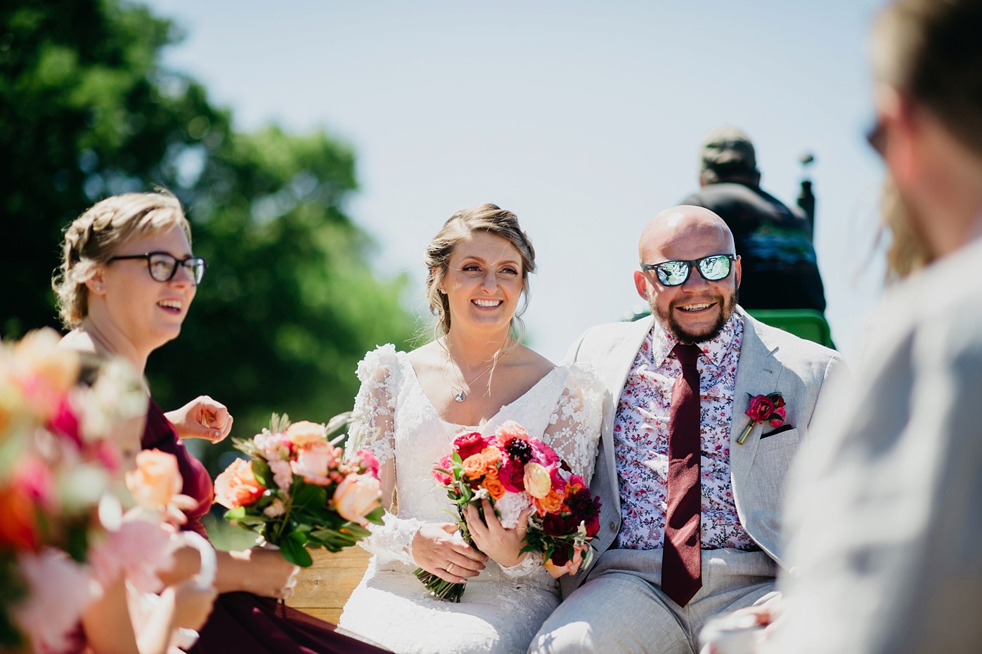 bride and groom on tractor at Birchview Outdoor Wedding in Linden Michigan